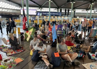 Dozens of people occupied Schiphol Airport, bringing colourful banners and holiday essentials.