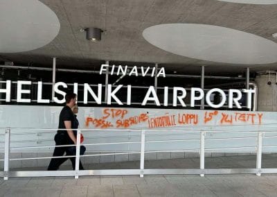 After blocking the security control at Helsinki-Vantaa airport, XR Finland returned to the airport to "decorate" the building.